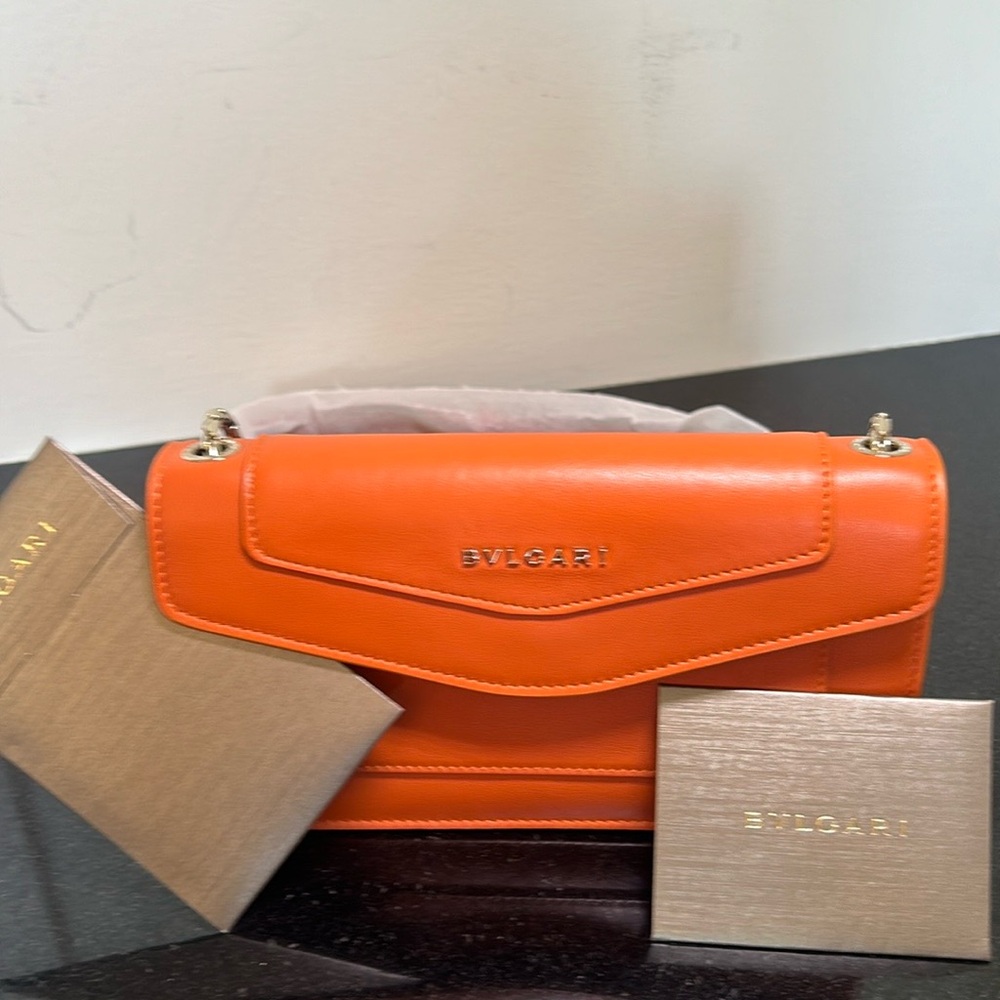 BVLGARI Crossbody Bag
•   Orange Leather
•   Single Adjustable Shoulder Strap
